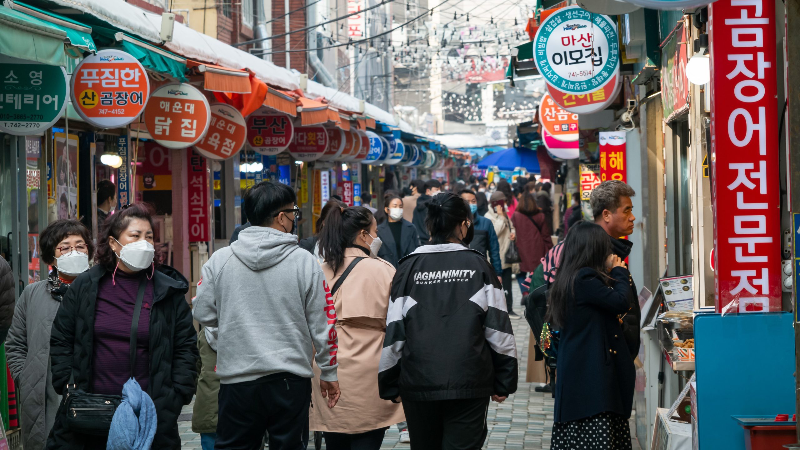 Street and people of traditional market in Haeundae, Busan, South Korea.