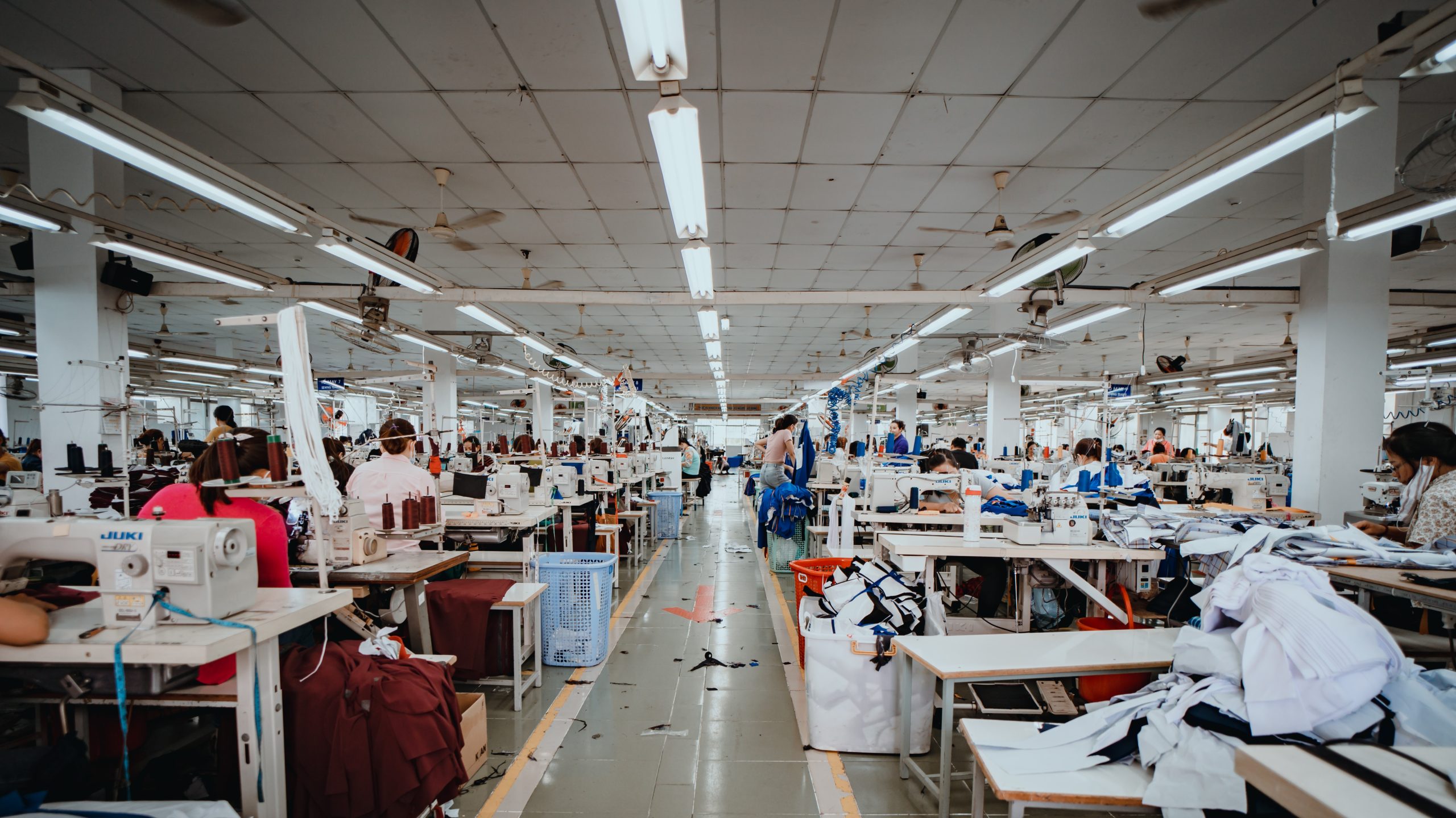 Textile cloth factory working process tailoring workers equipment.